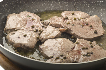 veal tenderloin with green pepper in the pot