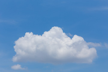 single white cloud on clear blue sky background