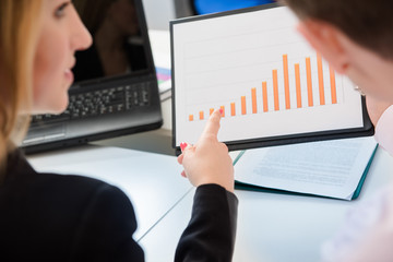 Colleagues discussing companys KPI