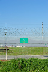 Signboard Customs Area on a barbed wire at the airport