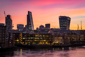 Night photo of London silhouette, offices by the Thames river 