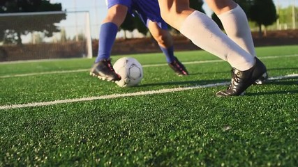 A soccer player does some fancy footwork while going up against other players - Powered by Adobe