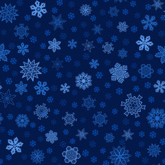 Seamless blue winter background with snowflakes. Vector pattern for Christmas and New Year holidays.