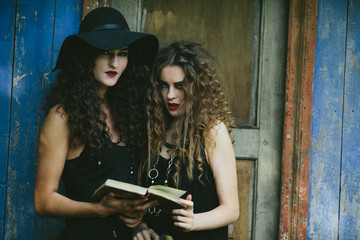 two vintage women as witches