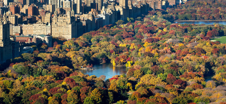 Central Park and Manhattan, Upper West Side with colorful Fall foliage. The aerial view includes buildings of Central Park West, The Lake and the Jacqueline Kennedy Onassis Reservoir. New York City.