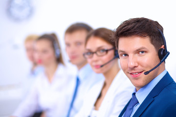 Attractive Smiling positive young businesspeople and colleagues in a call center office