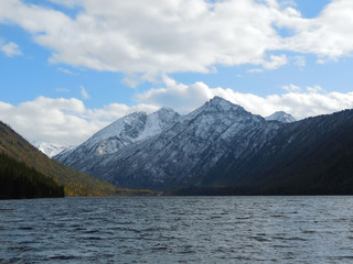Multinskiye views of the lake and the tops of the mountains in the Altai Republic. Russia