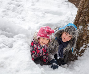 Children playing in a snow cave