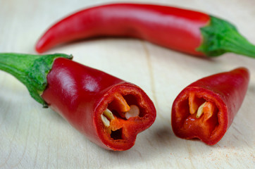Red pepper and a sliced section with seeds