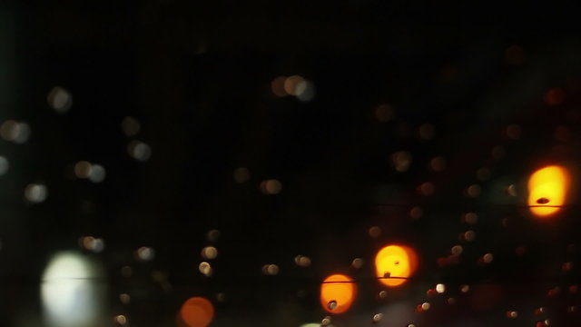 blurry lights on road through rear window of car loopable

