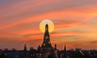 Wat Arun sunset light reflection pool in Bangkok Thailand.