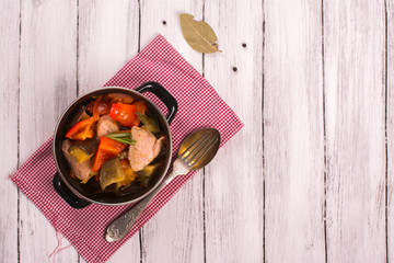 Colorful ratatouille with veal steak. Top view. Selective focus