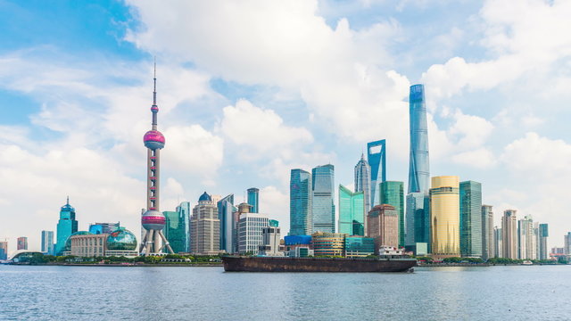 Time-lapse photography 4k-Skyline view from Bund waterfront on Pudong New Area- the business quarter of the Shanghai. Shanghai in most dynamic city of China.