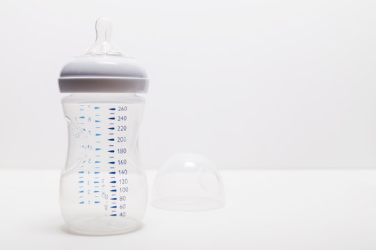 Baby milk bottle with removed lid