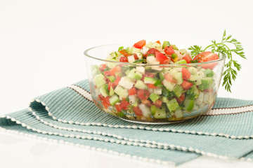 Mixed green salad in glass bowl