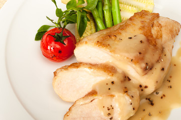 Fried chicken fillet in white cream sauce