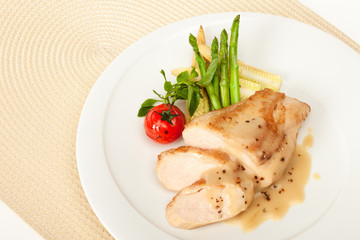 Fried chicken fillet in white cream sauce