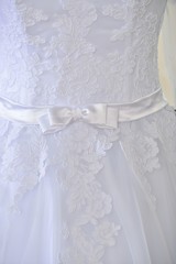 White  bow on wedding dress