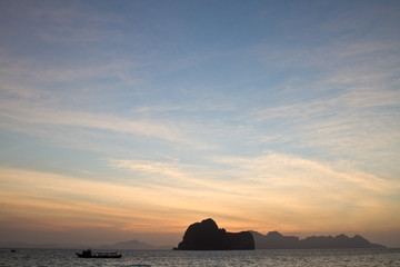 Naklejka na ściany i meble Sunset at beach in Krabi Thailand