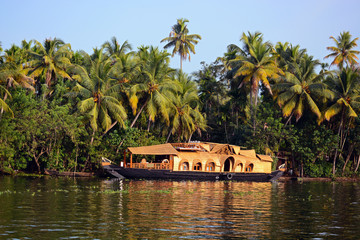 Traditional rice boat "Ketuvallam" in backwater of Kerala , India