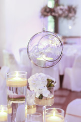 Obraz na płótnie Canvas Glass sphere with candle inside. Wedding decoration.