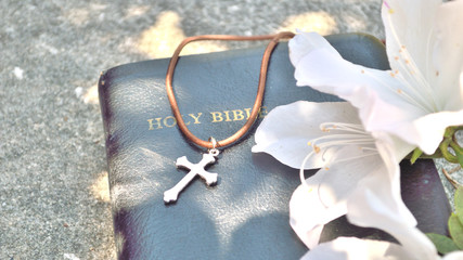 Christian cross and Bible background