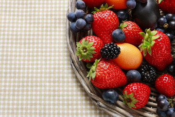Strawberries, blueberries, blackberries, grapes and kumquats on