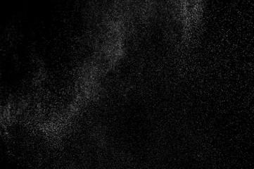 abstract splashes of water on a black background. splashes of milk. abstract spray of water. abstract rain. shower water drops.  white dust explosion. abstract texture. abstract black background.