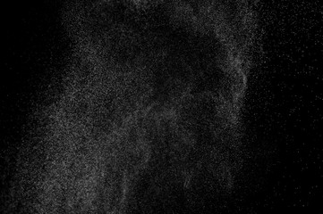 abstract splashes of water on a black background. splashes of milk. abstract spray of water. abstract rain. shower water drops.  white dust explosion. abstract texture. abstract black background. - obrazy, fototapety, plakaty