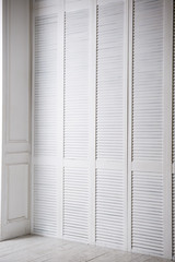 White wooden lining studio wall, corner view