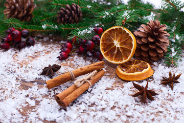 Obraz na płótnie Canvas Christmas fir tree with snowfall on wooden board
