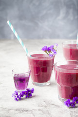 Blueberry, blackberry, honeysuckle, honeyberry smoothie with violet syrup and acai. 