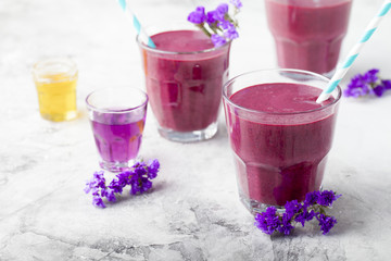 Blueberry, blackberry, honeysuckle, honeyberry smoothie with violet syrup and acai. 