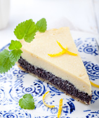 Poppy seed cream tart, cake, pie slice with lemon zest 