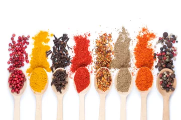 Foto op Canvas collection of spices on spoons, isolated background © droonny