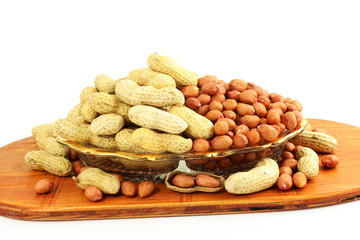 peanuts whole and peeled in white background