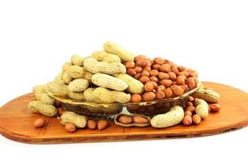 peanuts whole and peeled in white background