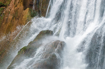Fototapeta na wymiar Waterfall close up water drops on rock