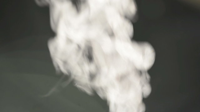Steam or water vapour coming out of a small toy chimney
