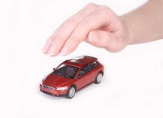 toy car covered with female hand