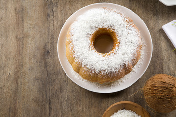 coconut cake with slice on the table