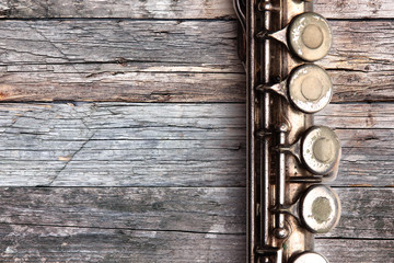 Old flute on rusty wooden boards © Zerophoto