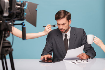 Cheerful male reporter before telling some news