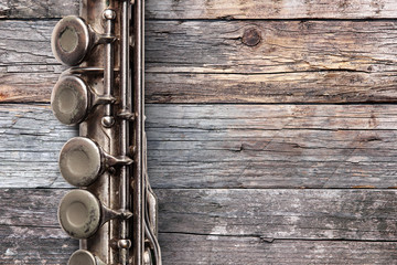 Old flute on rusty wooden boards