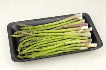 Raw Asparagus in a Plastic Tray