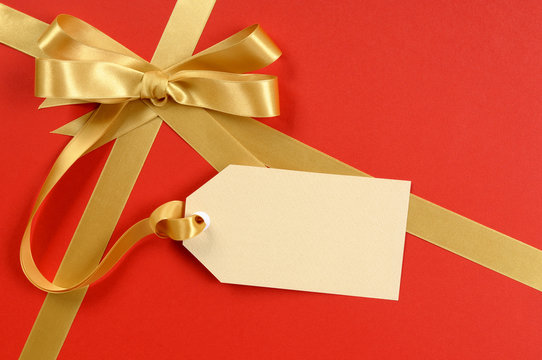 Red Christmas Gift Background, Gold Ribbon Bow, Blank Gift Tag Or Labe