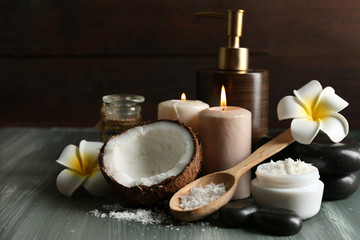 Fototapeta na wymiar Spa coconut products on dark wooden background