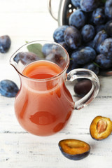 Plum Juice in a jar with fresh fruits