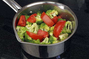 Raw Tomatoes and Broccoli in a Pan