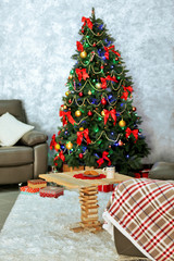 Beautiful Christmas interior with decorated fir tree